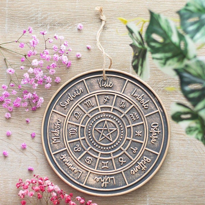 Hanging terracotta plaque with an engraved Wheel of the Year design