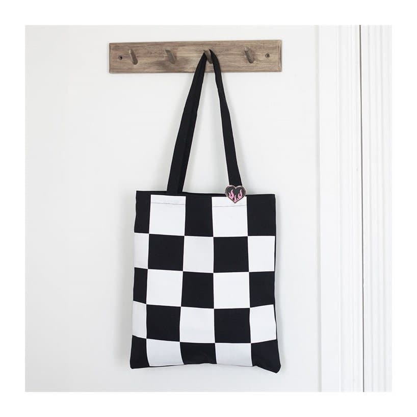 Checkerboard tote bag with a heart pin