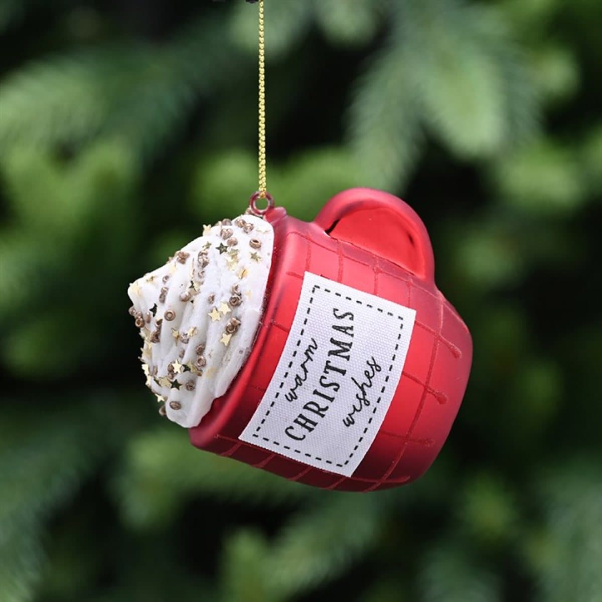 Glass red mug Christmas decoration filled with whipped cream