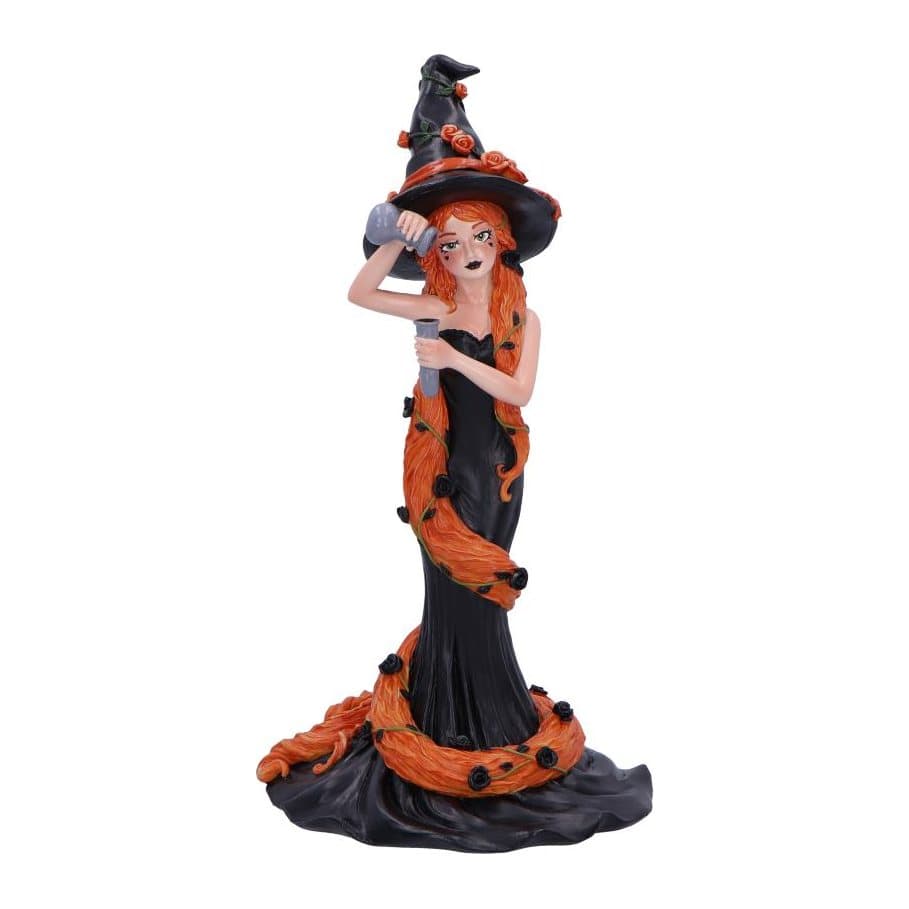 Cinnamon witch figurine in a black hat with orange roses and ginger hair