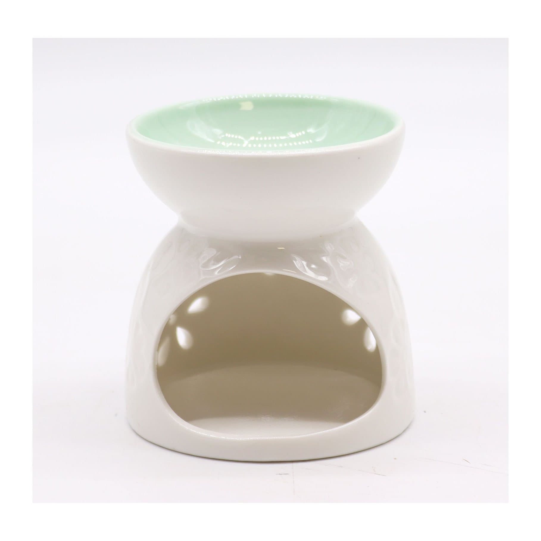 White ceramic oil burner with a pretty cut-through design