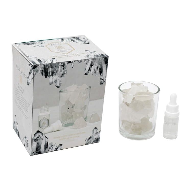 Glass jar of clear quartz crystals with fragrance oil