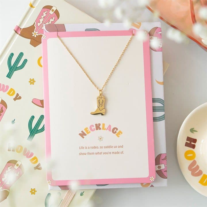 Cowboy boot necklace on a greeting card