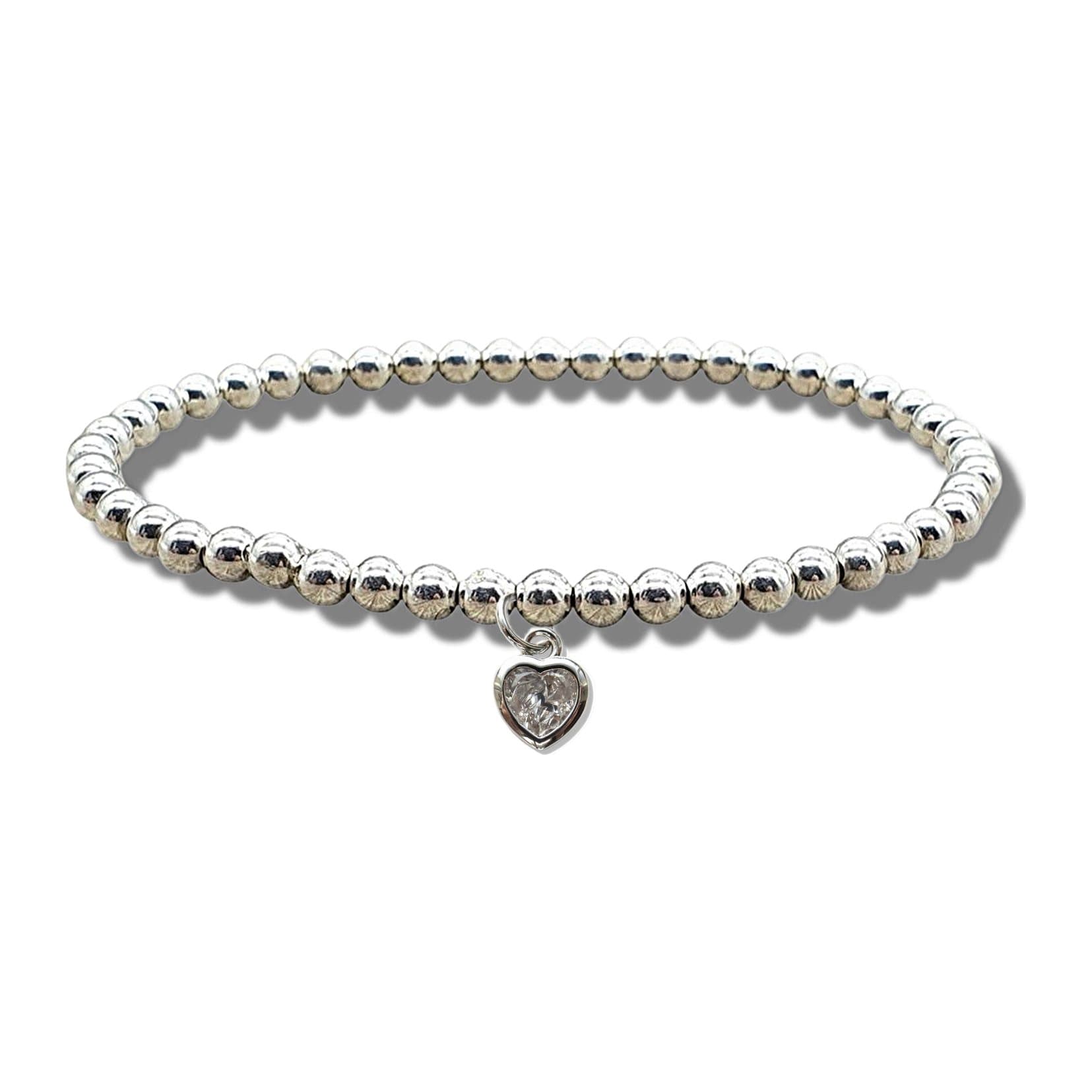 Silver beaded stretch bracelet with a cubic zirconia heart charm