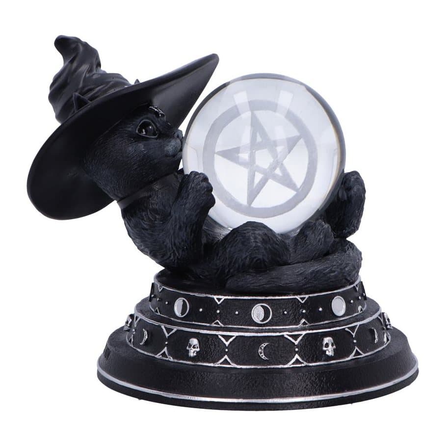 Purrah witch cat figurine lying on her back with a glass ball