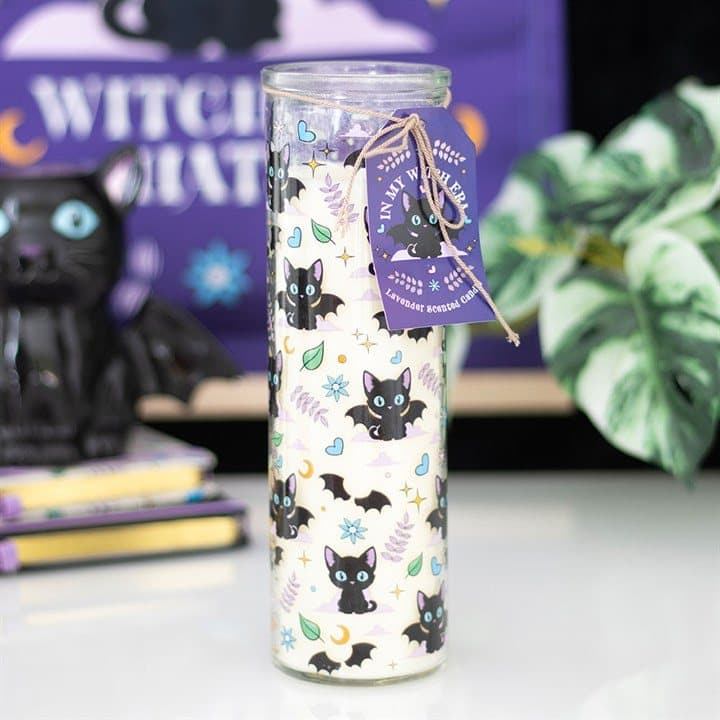 Lavender tube candle printed all over with mischievous black cats