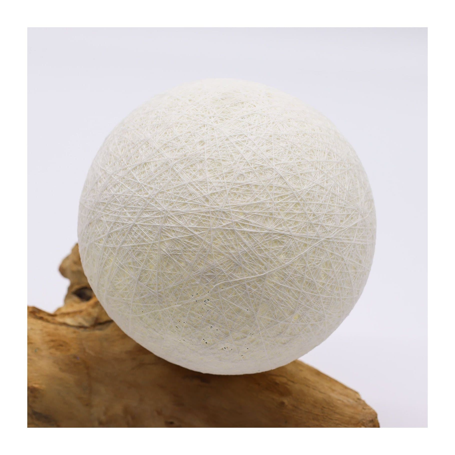 Driftwood lamp with an ivory sphere shade