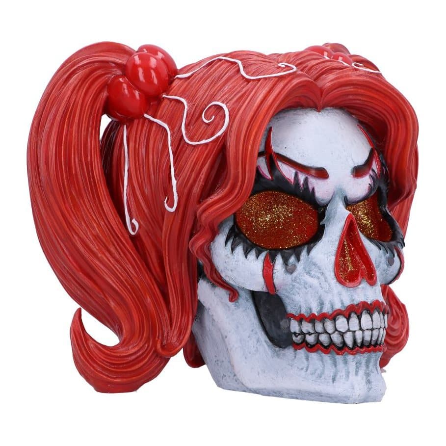 Resin skull with clown makeup and fiery red hair