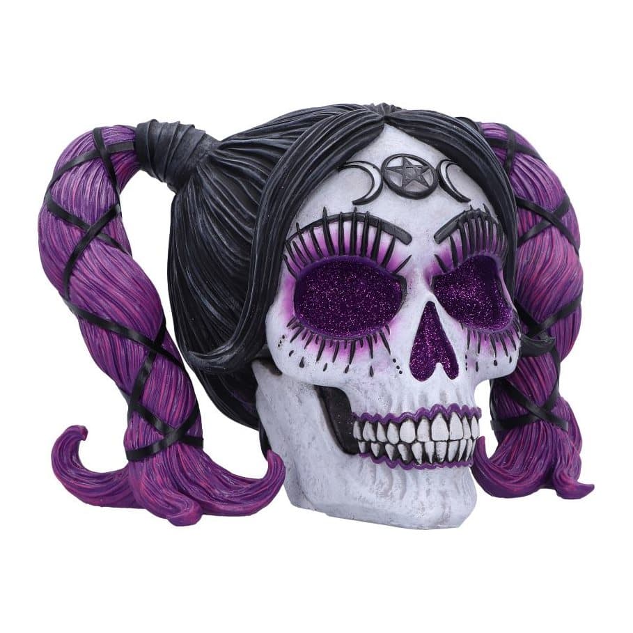 Purple resin skull decorated with voodoo patterns