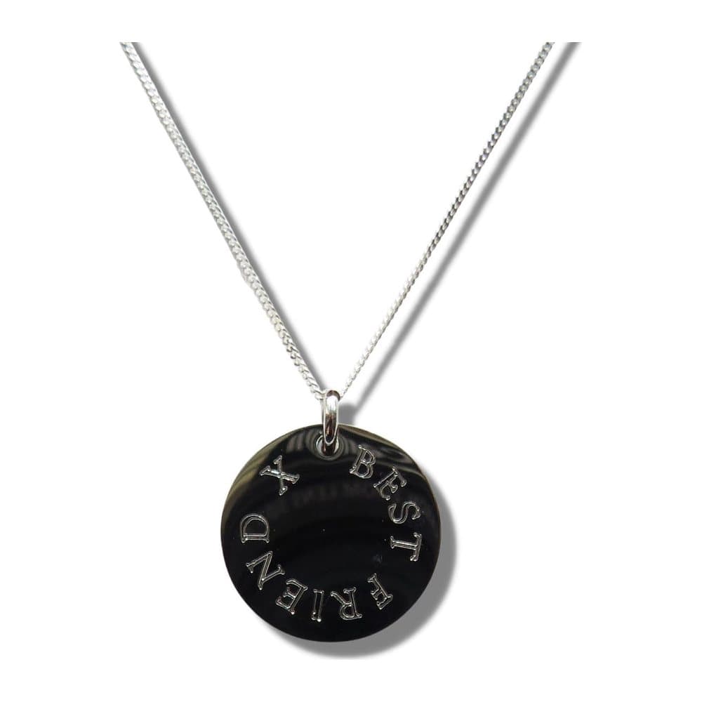Engraved necklace with a disc reading BEST FRIEND X on a silver chain