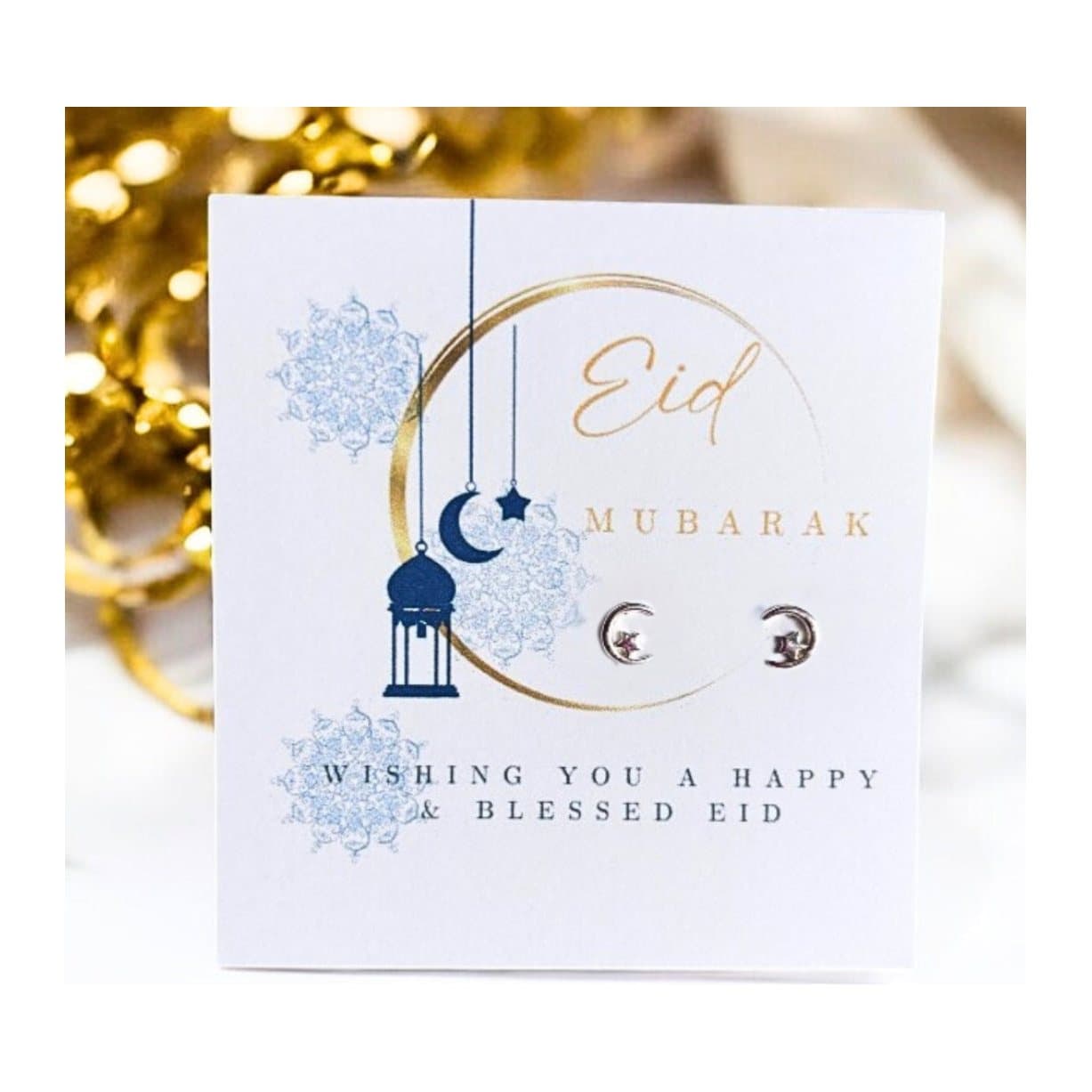 Eid Mubarak moon and star earrings on a message card