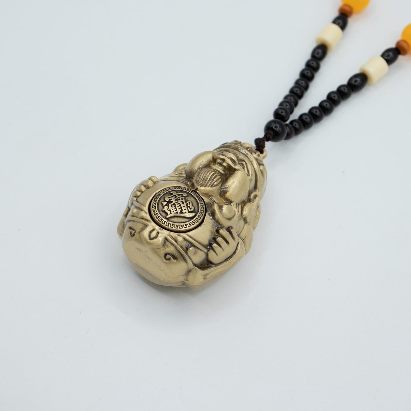Metal God of Wealth feng shui hanging with wealth coin and beaded cord