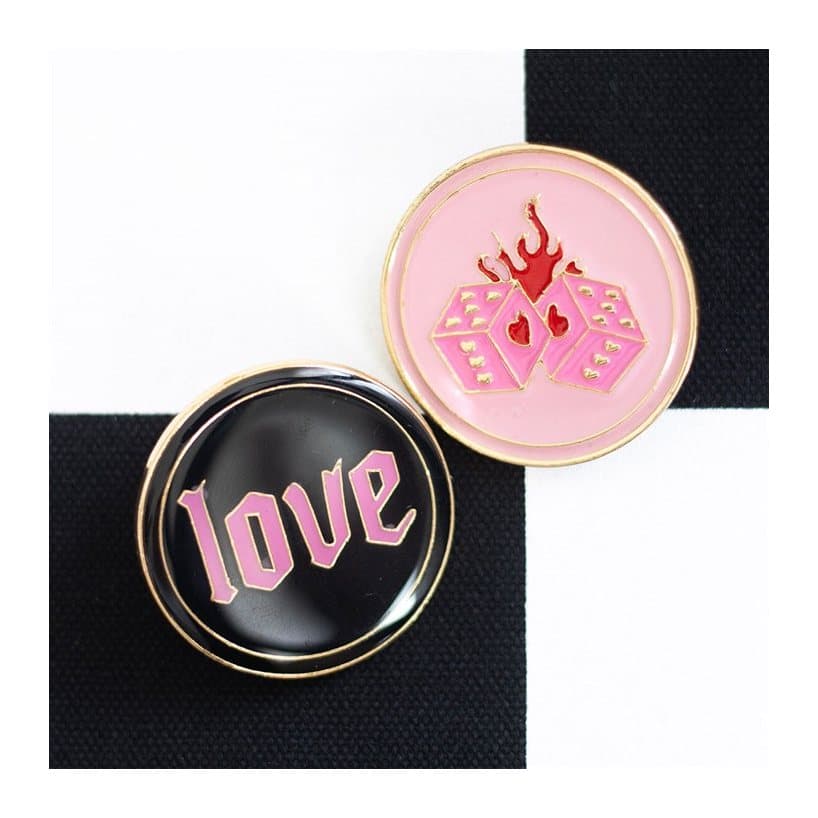 Pink flaming dice and Love pin badges on a card