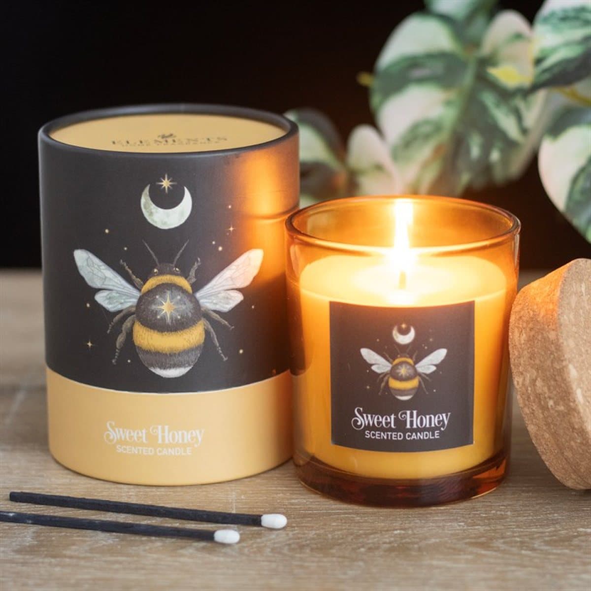 Glass candle with a forest bee design and cork lid