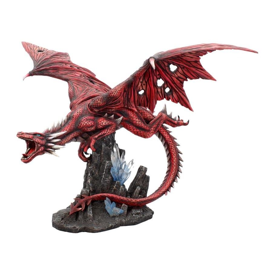 Large red dragon figurine roaring on black rock with blue crystals