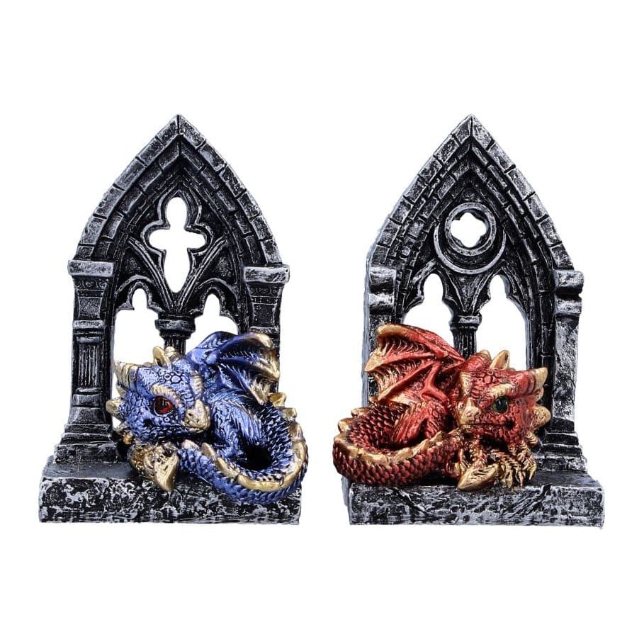 Blue and red dragon figurines each curled up in front of a gothic door