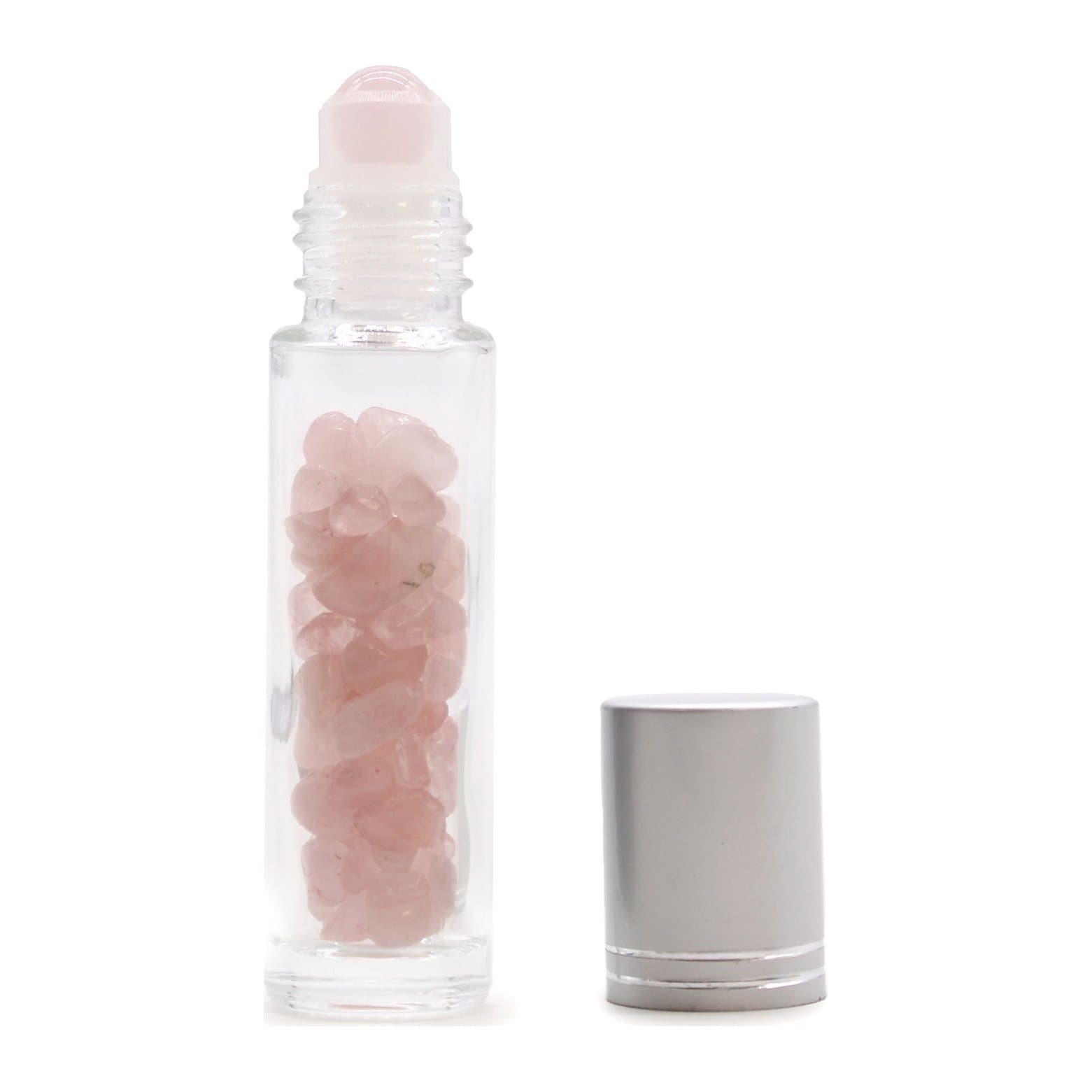 Rose quartz gemstone essential oil roller bottle with a silver cap