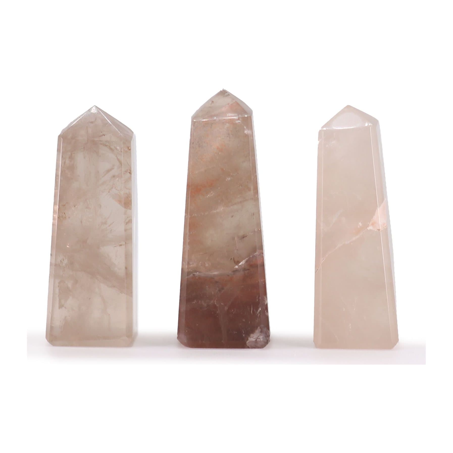 Polished smokey quartz obelisk point with smoky translucent tones