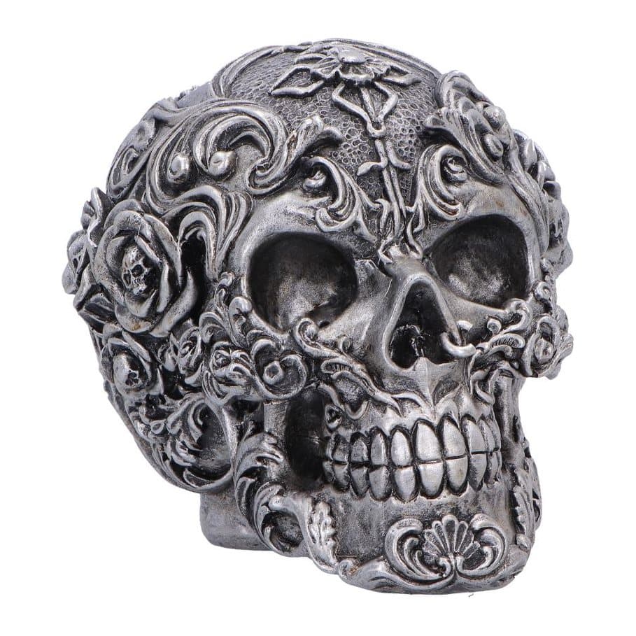 Dark silver gothic skull figurine with sculpted swirls and flowers