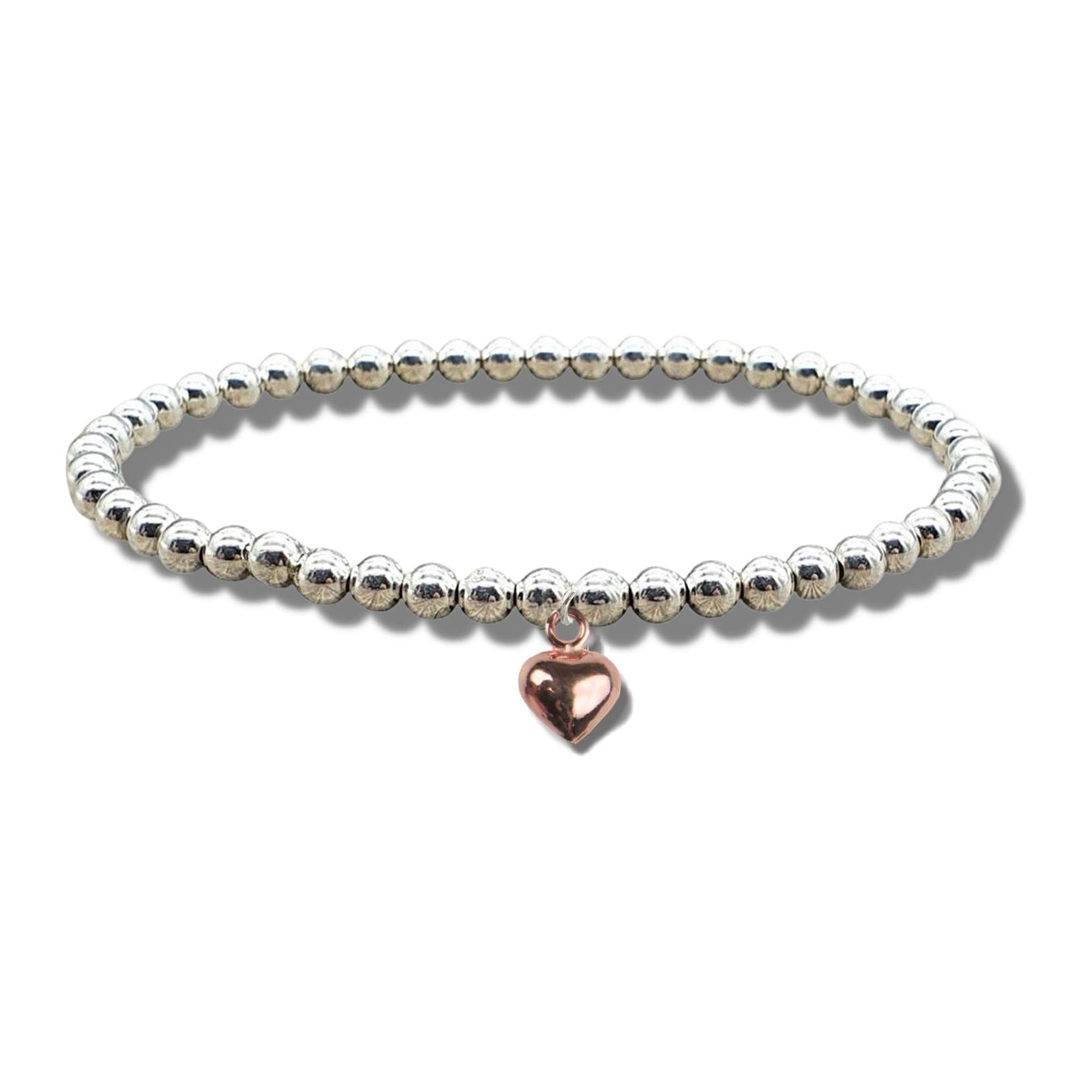 Rose gold mini puff heart charm on a silver beaded stretch bracelet