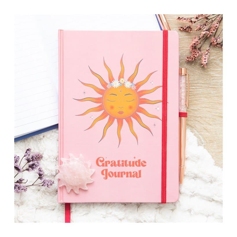Gratitude journal with a themed cover and a crystal pen