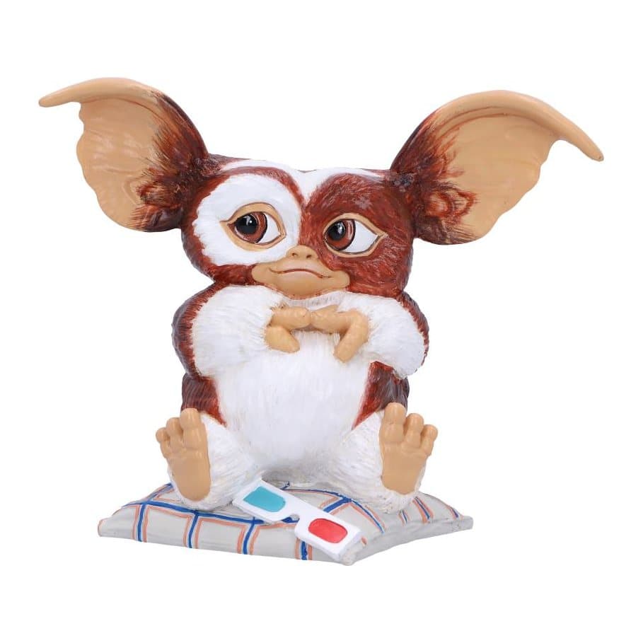 Gremlins Gizmo figurine with 3D glasses sitting on a chequered pillow