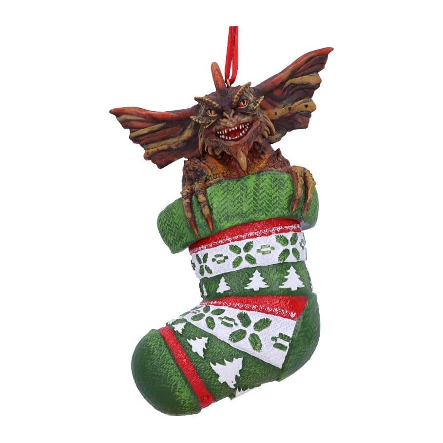 Gremlin with a Santa hat hanging in a fairisle stocking as a Christmas ornament