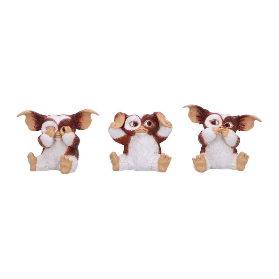 Three brown and white Gremlins figurines, each in a different pose