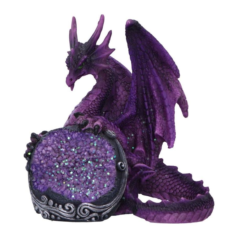 Purple dragon figurine with green eyes behind a black orb of purple geode crystals