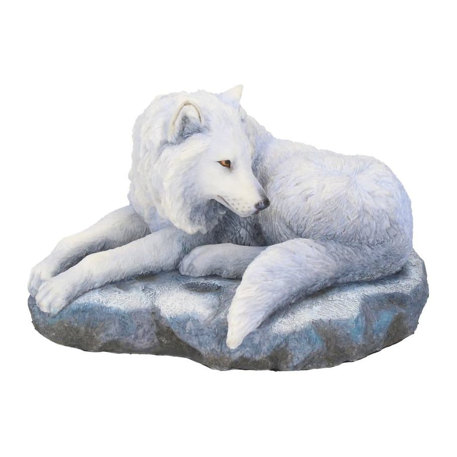 White wolf figurine lying on a rocky outcrop with fierce orange eyes