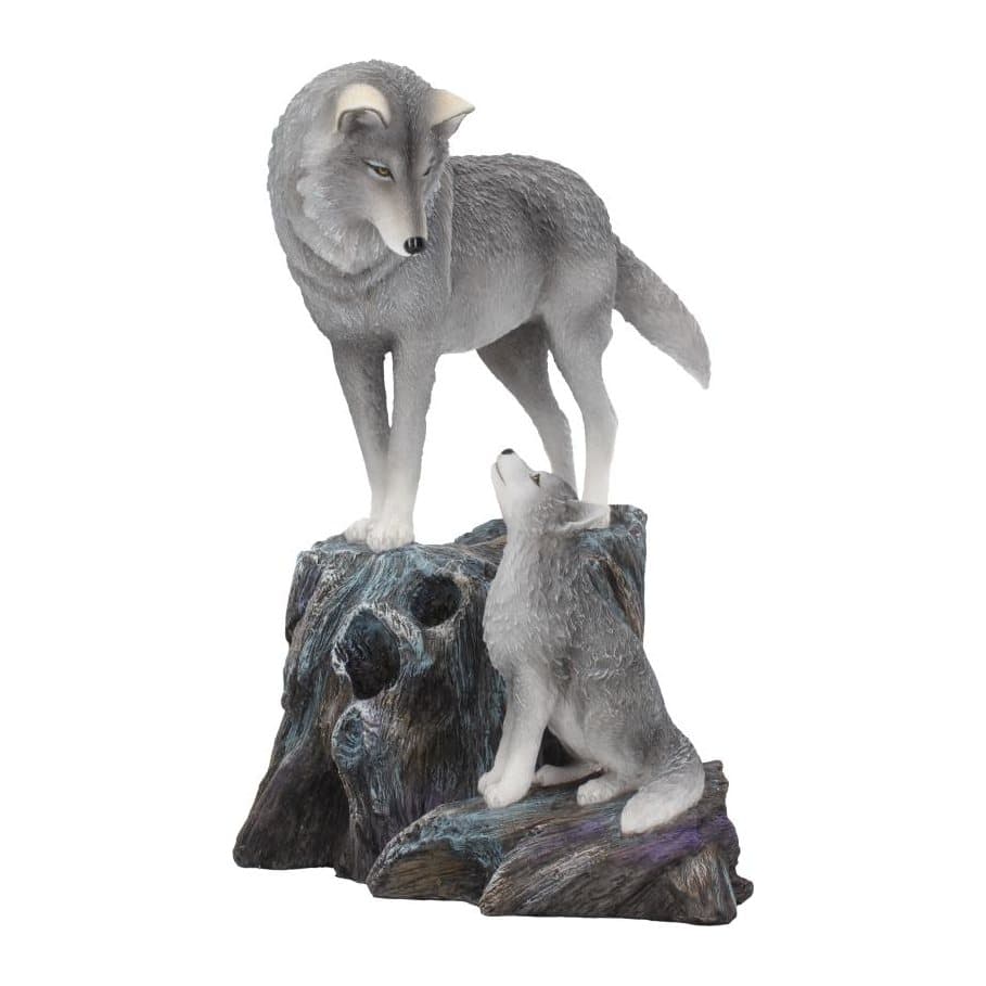 Resin wolf standing on a tree root looking down at a pup