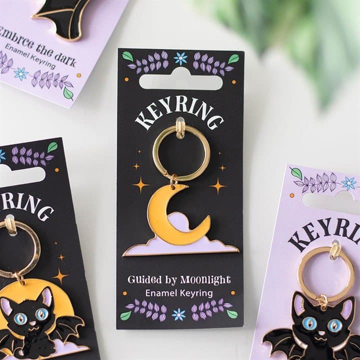 Yellow and lavender celestial enamel keyring on a matching backing card