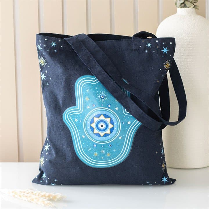 Dark blue polycotton tote bag with a Hand of Hamsa design and star accents