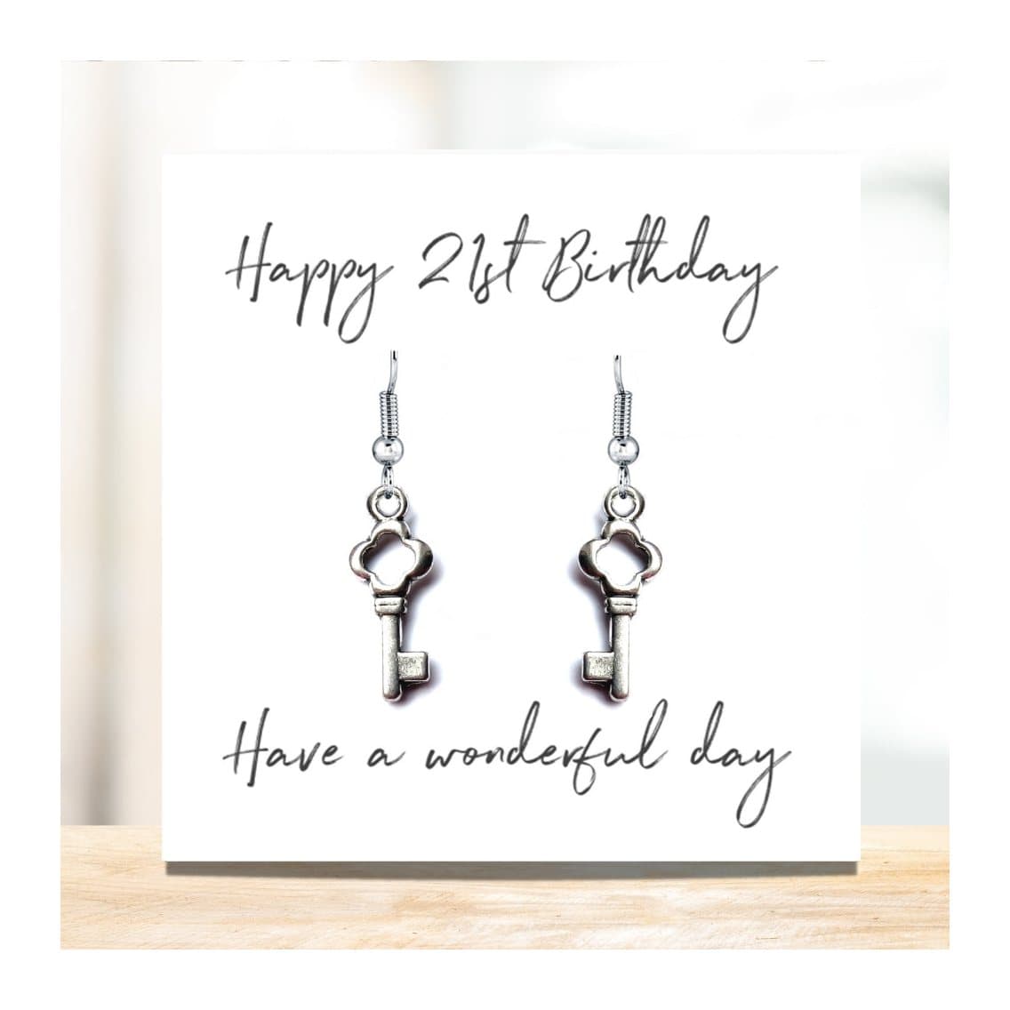 Drop earrings with a key charm, with a Happy 21st Birthday message card