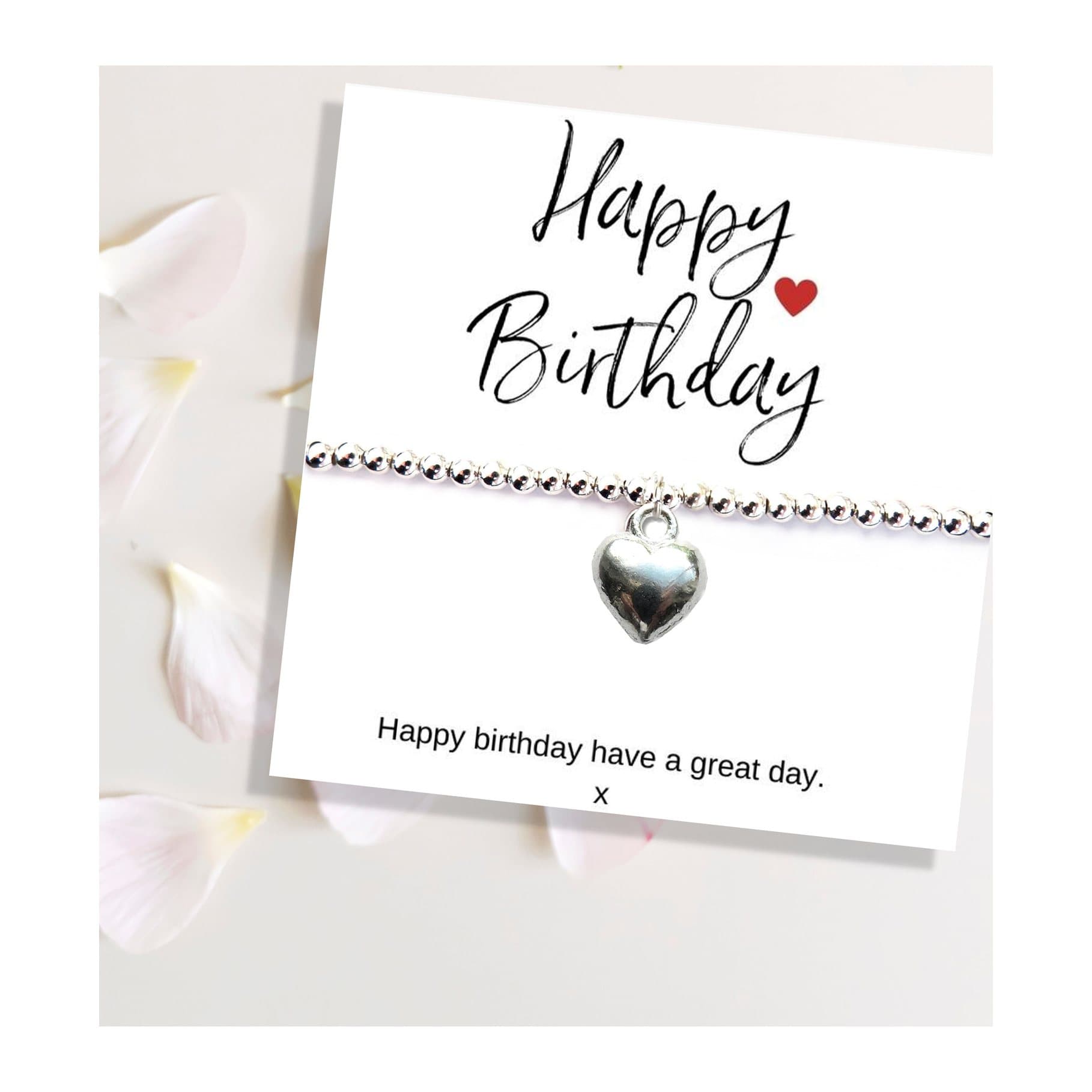 Silver beaded heart charm bracelet on a Happy Birthday gift card