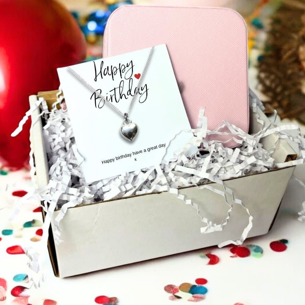 Silver heart charm necklace, pink jewellery box and Happy Birthday card