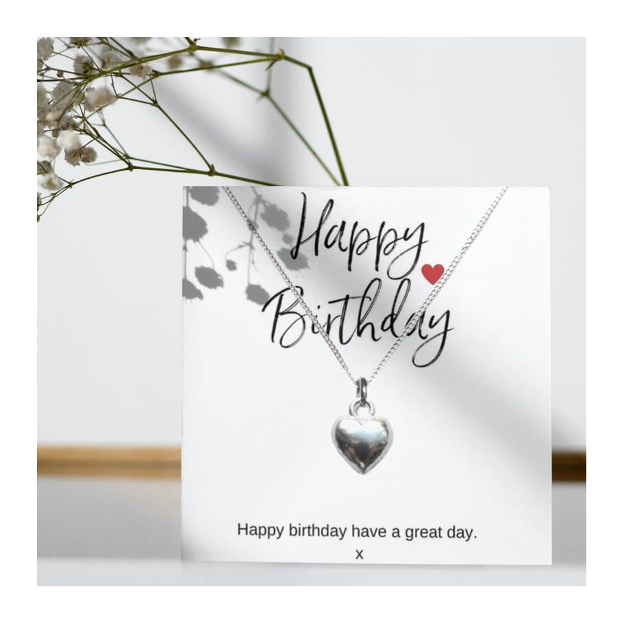 Silver heart charm necklace presented on a Happy Birthday message card