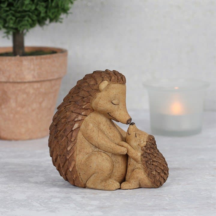 Resin mother and baby hedgehog ornament in a cuddle
