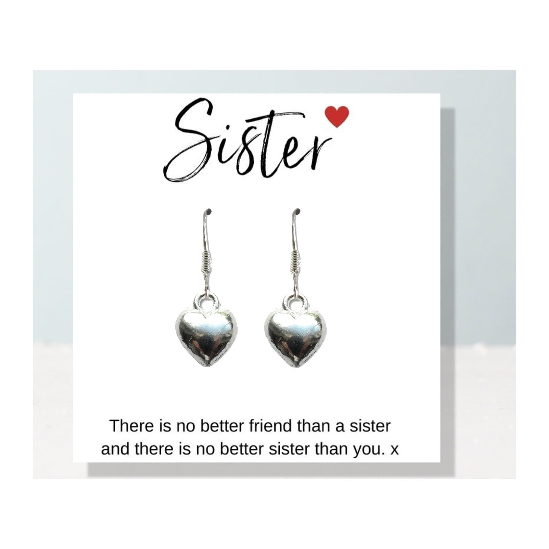 Heart earrings on a sister gift card, with a sister quote