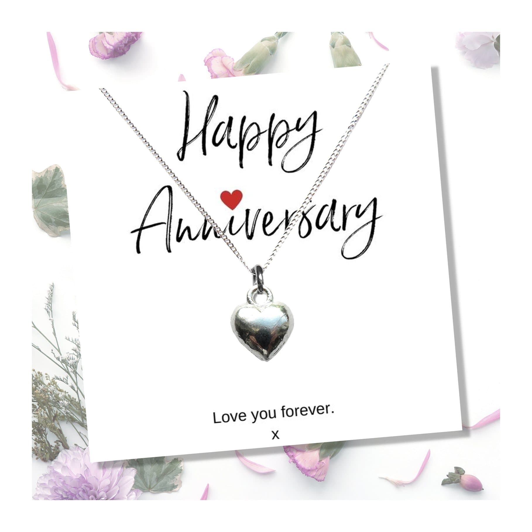 Silver heart charm necklace presented on a Happy Anniversary message card