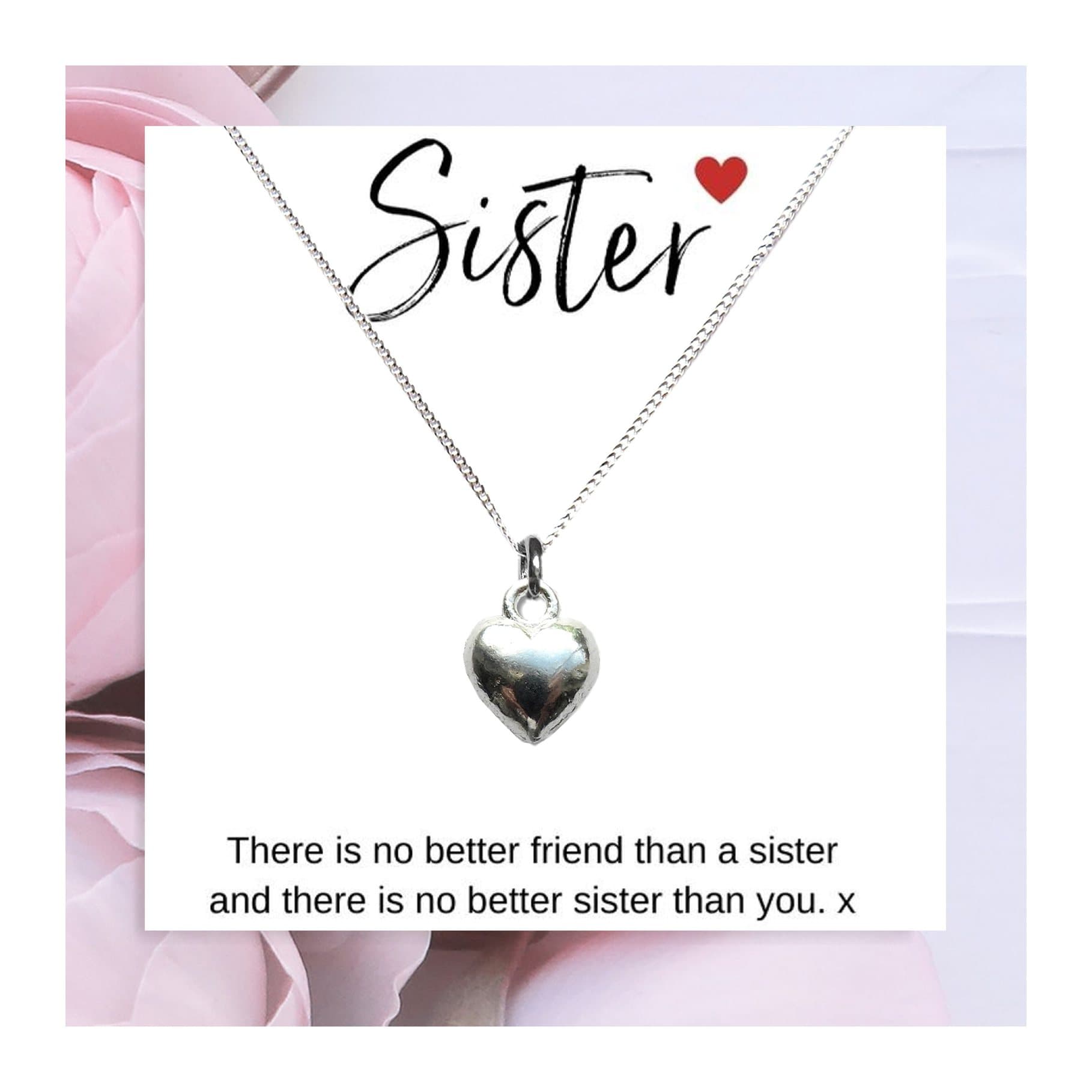 Silver heart charm necklace on a sister gift card