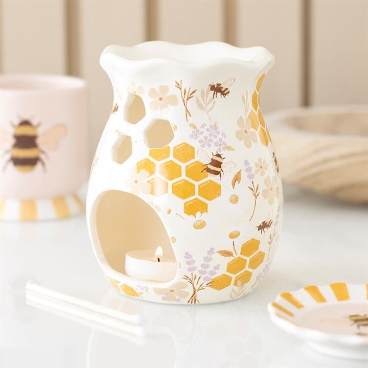 Fluted ceramic oil burner with a honey bee and floral print