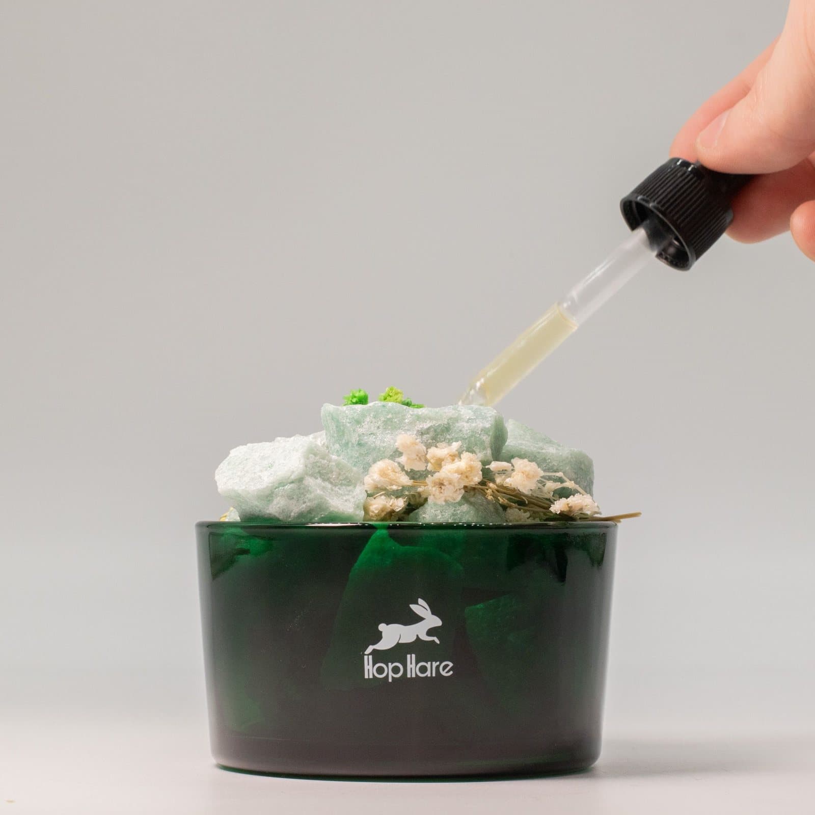 Raw Green Aventurine crystals with dried flowers in The Magician diffusing set