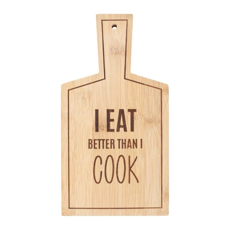 I Eat Better Than I Cook text on a bamboo serving board