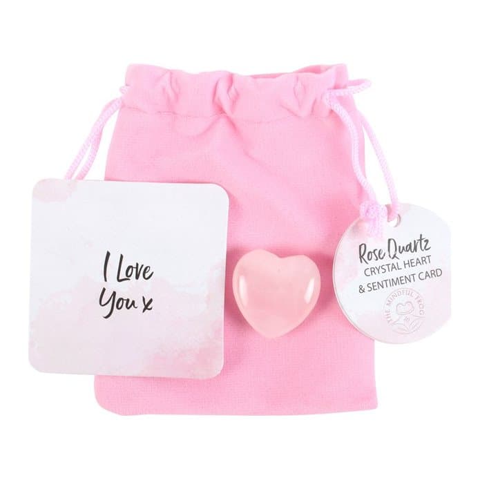 Rose quartz crystal heart in a pink velvet drawstring bag with an I love you x card