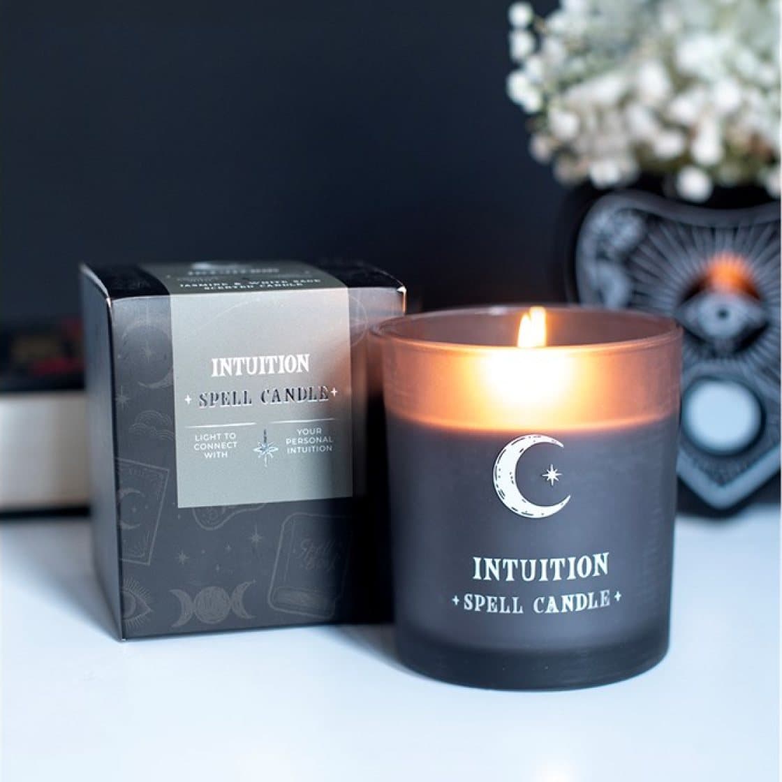 Intuition jasmine and white sage candle in a smoky grey glass jar
