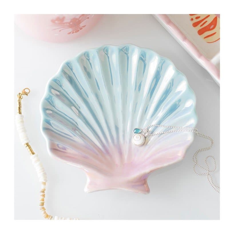 Ceramic seashell-shaped trinket dish with an iridescent pastel glaze