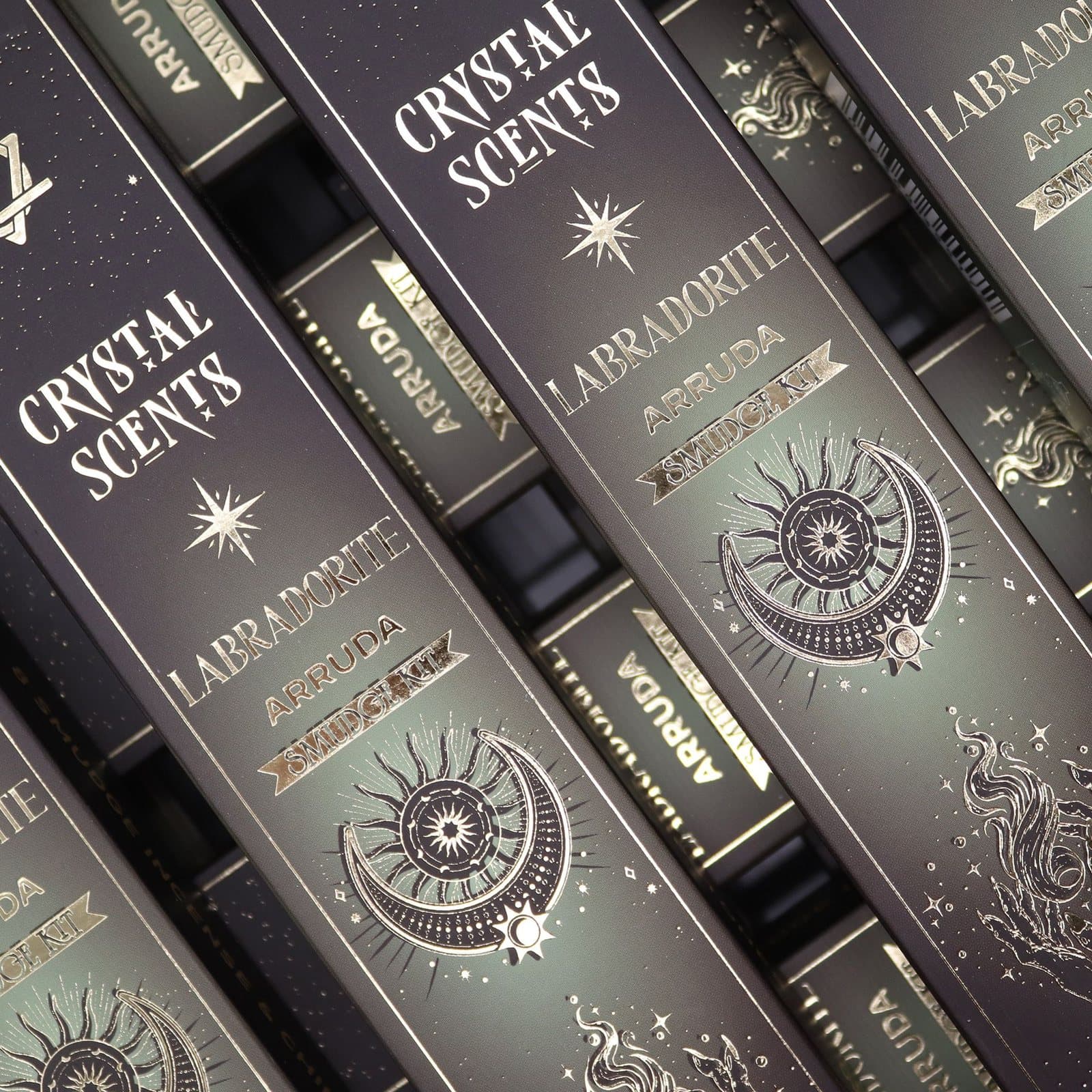 Arruda smudge incense sticks and labradorite chips in a deep green celestial sleeve