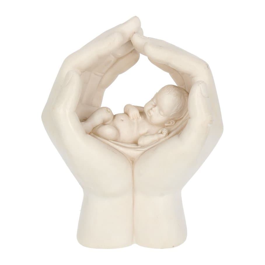 White resin figurine of a baby asleep in two cradling hands