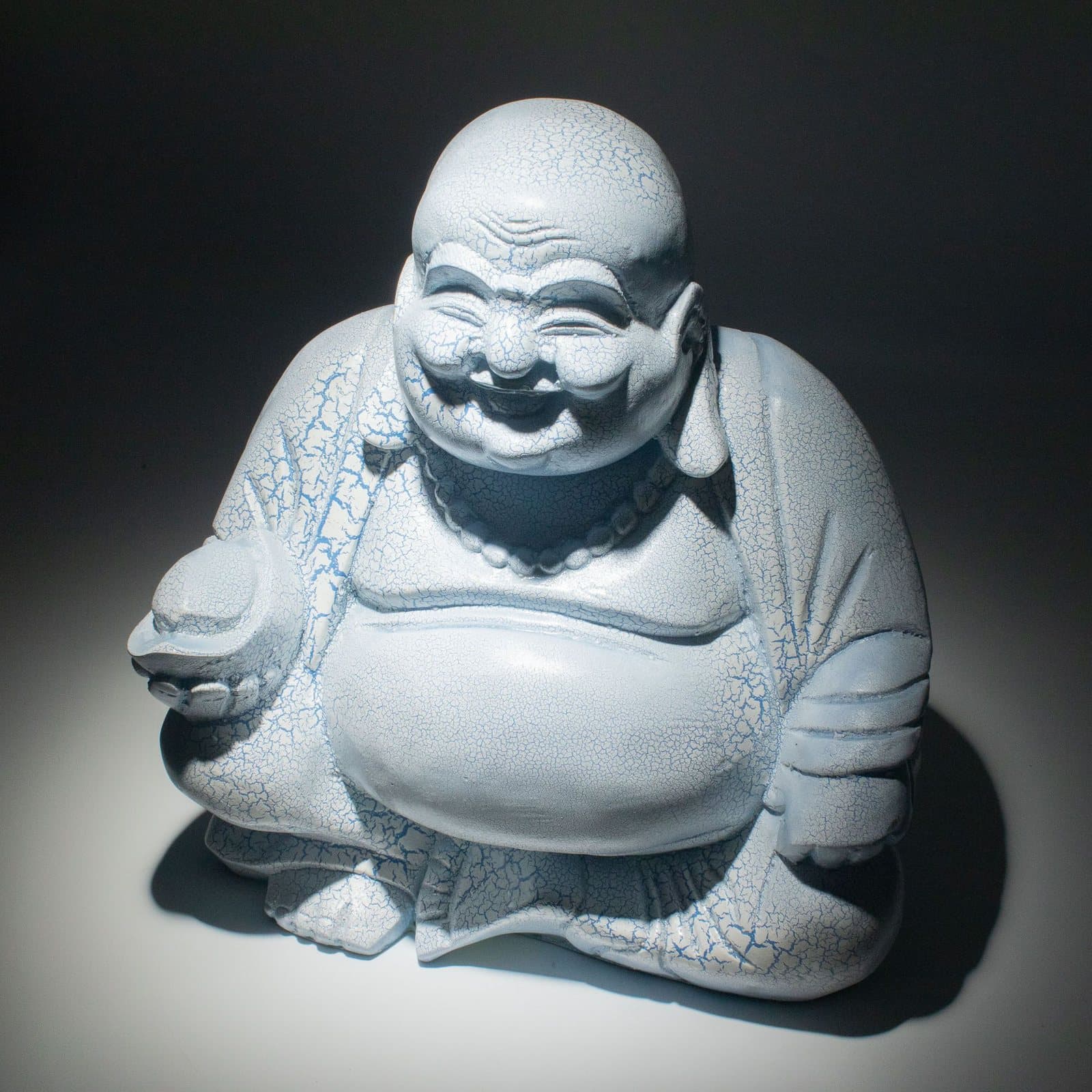Sky blue crackle Laughing Buddha lamp on a round base